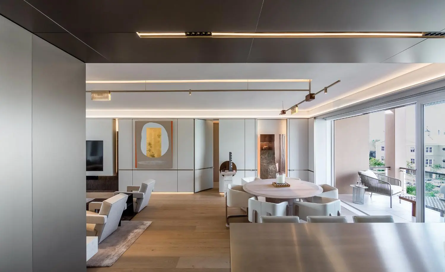 Dining and lounge with sandstone and walnut
