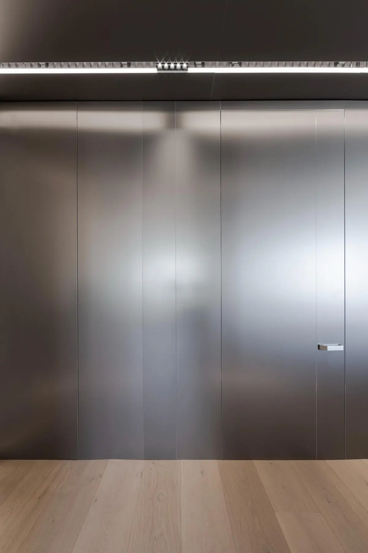 Drinks cabinet — minimalist mirror and hand-worked metal